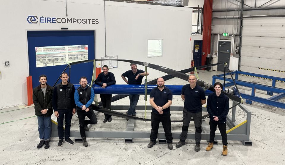 ÉireComposites staff pictured with a mobility marine piece